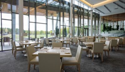 Group of tables served for guests of luxurious restaurant inside business center