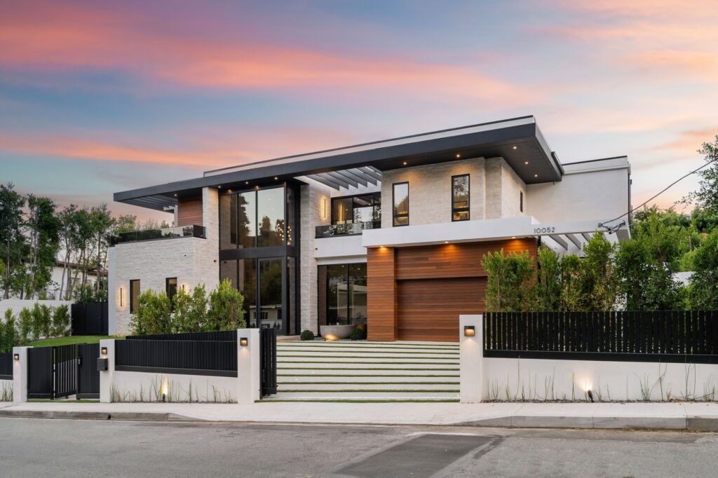 Modern luxury house exterior at sunset.
